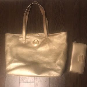 Gold Michael Kors purse and wallet